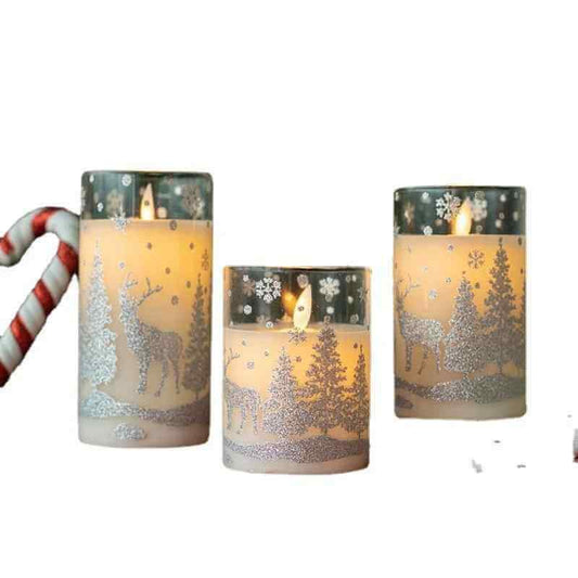 LED Christmas glass candles in festive glass cups with winter designs, creating a warm glow for the holiday season.