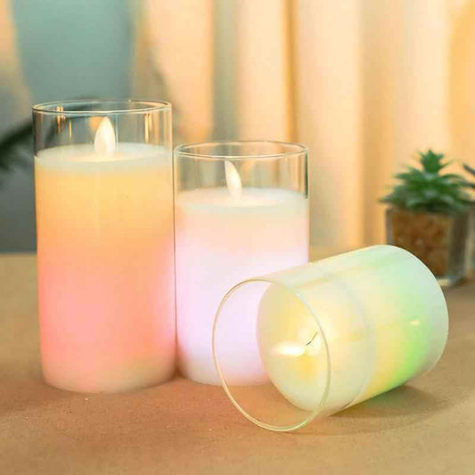 Color changing candles with remote control in glass cups illuminating a warm, inviting space.