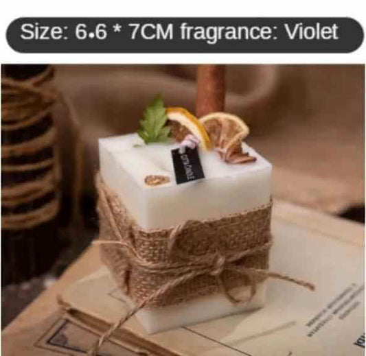 Smokeless scented candles in vintage style, adorned with natural elements, offering a violet fragrance for relaxation.