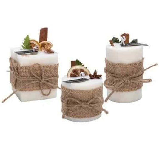 Three smokeless scented candles with natural decor and rustic twine, creating a calming atmosphere.