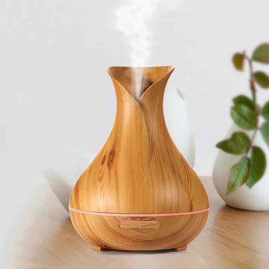Wood Grain Aromatherapy Diffuser and Humidifier with elegant design releasing mist into the room.