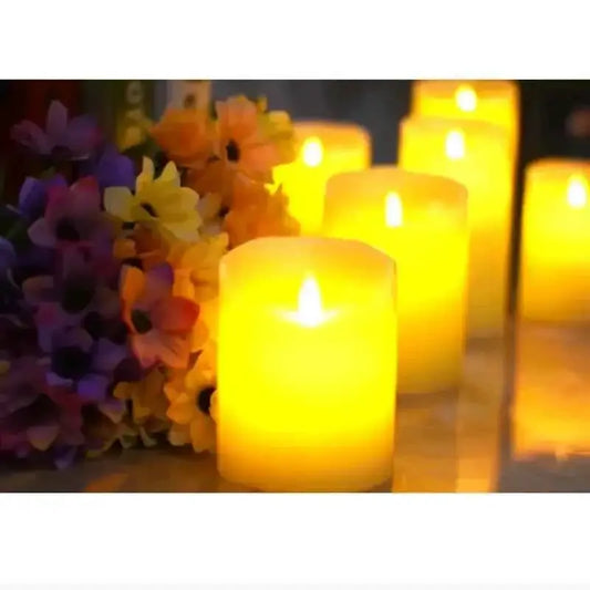 A warm display of 3pcs LED flameless candles with remote glowing softly amidst colorful flowers, enhancing home decor.