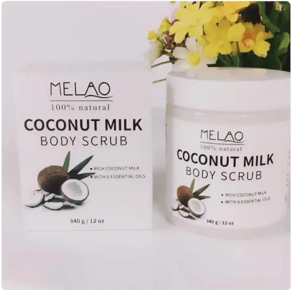 Handmade body scrub featuring Coconut Milk Body Scrub in packaging and jar with floral backdrop.