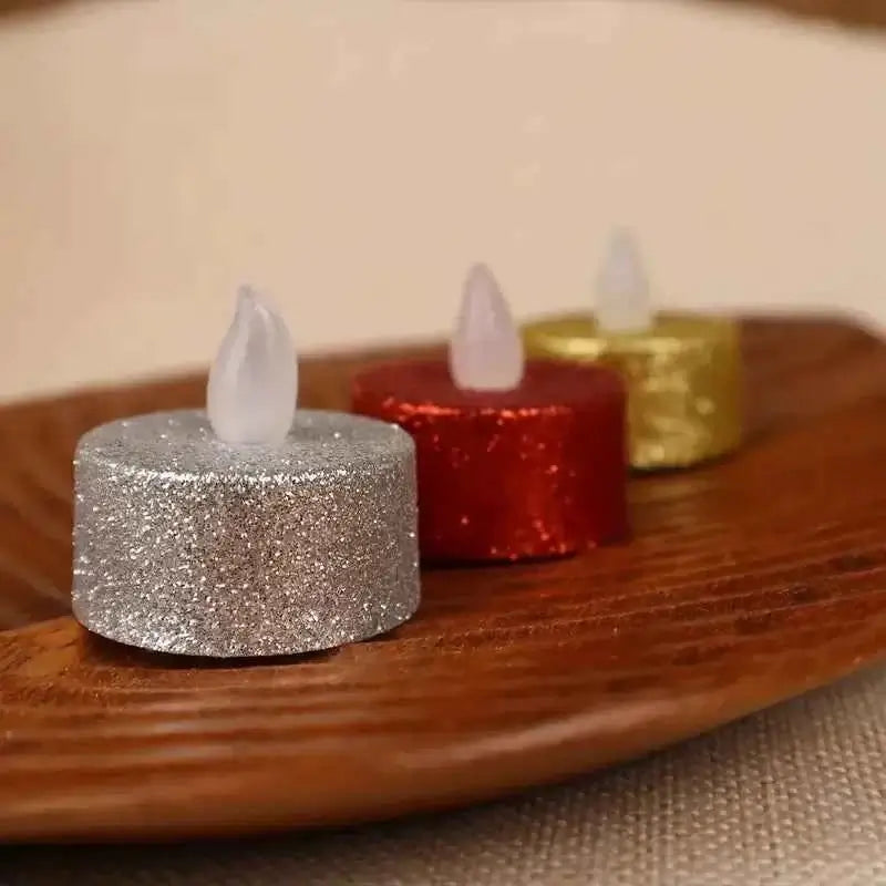 Flameless battery operated tea light candles in silver, red, and gold on a wooden plate, perfect for festive decor.