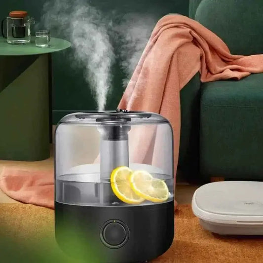 aromatherapy humidifier with sleek design producing soothing mist next to cozy blanket and furniture