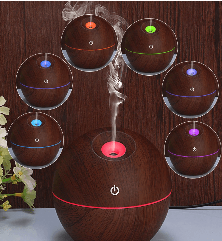 essential oil diffuser humidifier with 7 color LED lights and soothing mist in a warm wood design
