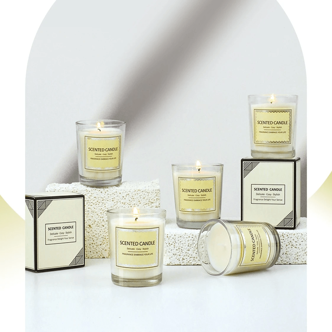 Small glass cups of aromatherapy soy wax candles with captivating scents displayed.