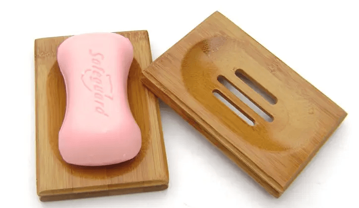 Handmade bamboo soap dish with pink soap, natural bamboo soap holder for bathroom decor.