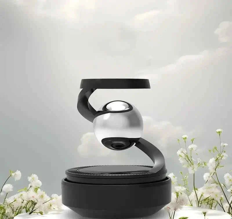 Solar car aromatherapy diffuser elegantly displayed with a sleek design and floral background.