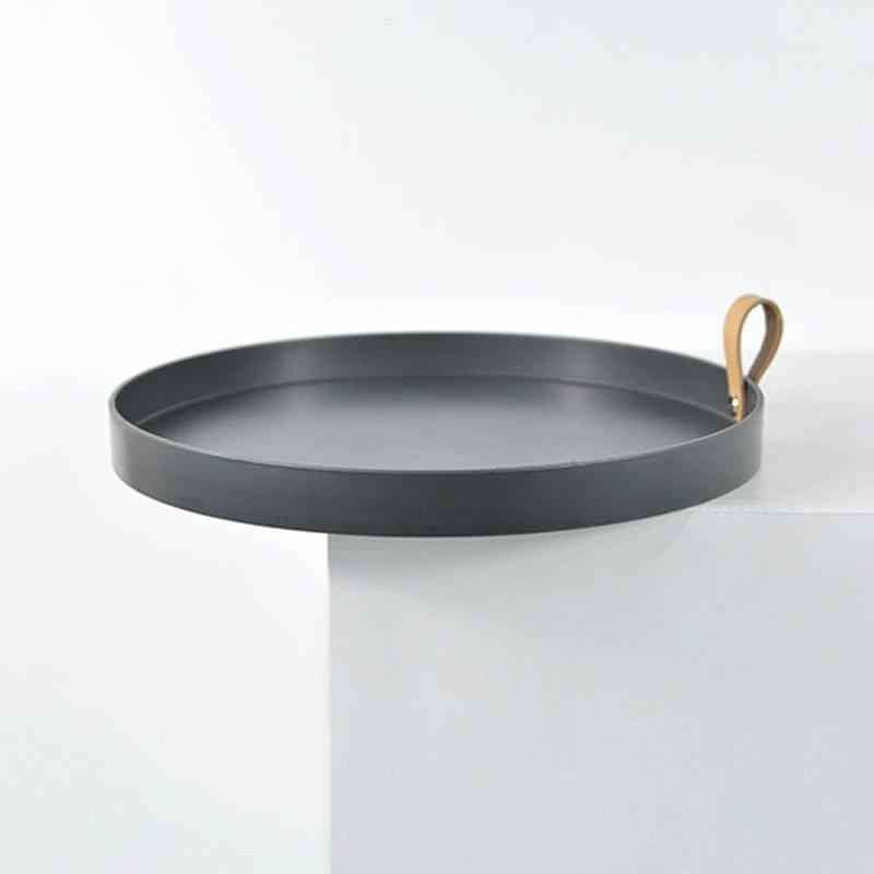 aesthetic vase tray for candles on a white surface with a leather handle accent