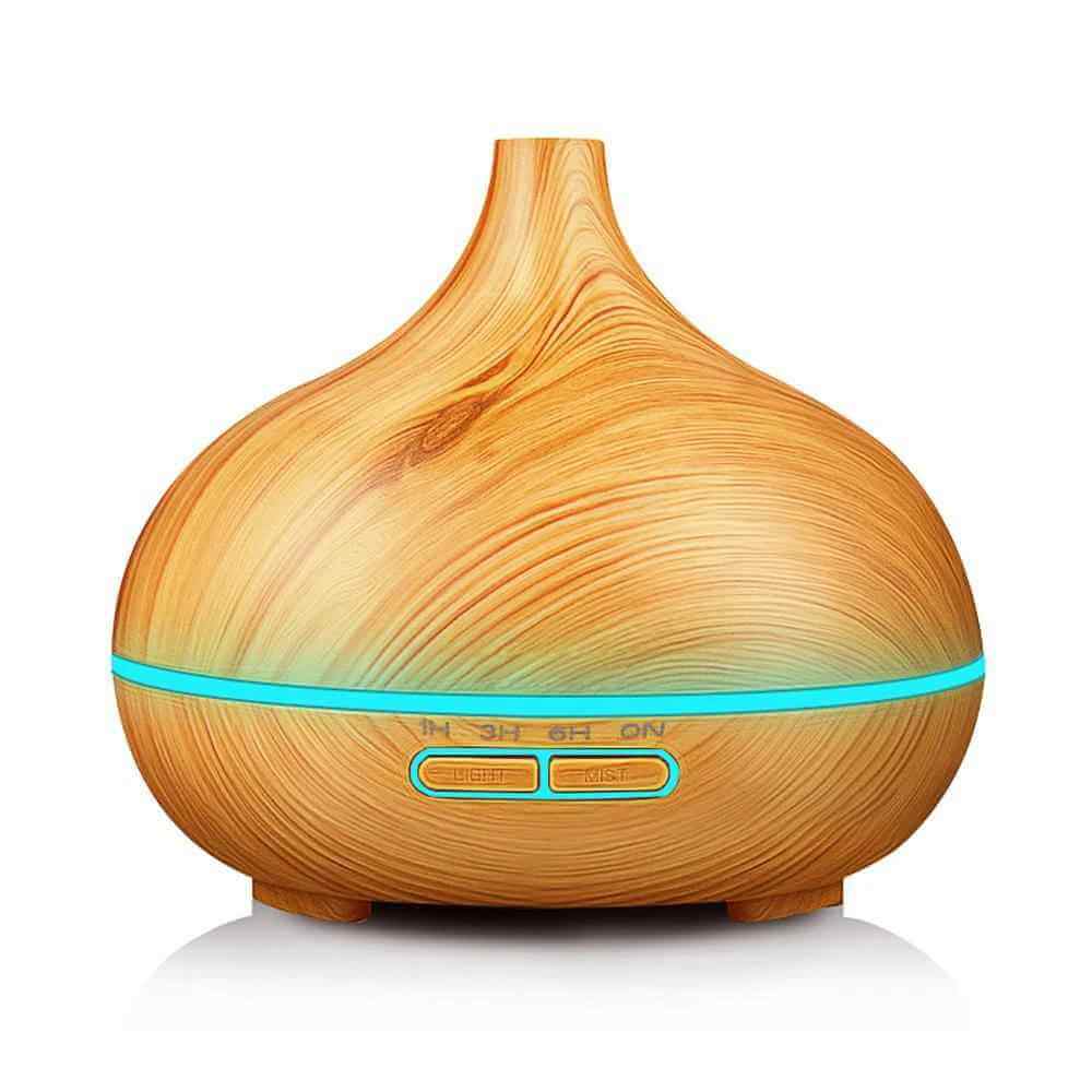 550ml Ultrasonic Aromatherapy Humidifier in wood design, featuring soft glowing light and aroma diffusion.