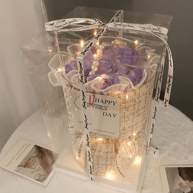 Elegant soap flower bouquet in a clear box with LED lights, perfect for special occasions.