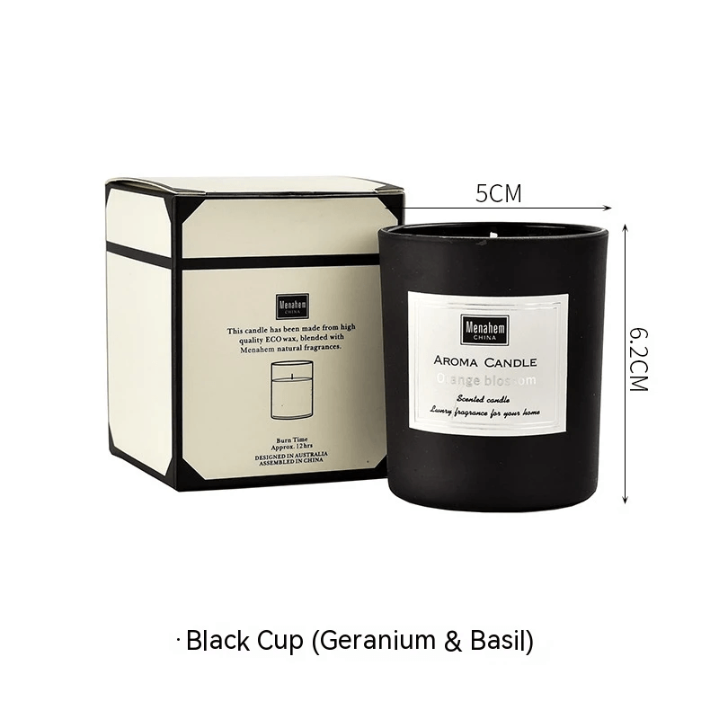 Indoor aromatherapy handmade aromatherapy candle in black cup with geranium and basil scent.