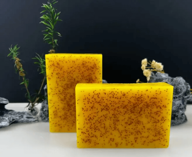 Turmeric citric acid soap bars with natural exfoliant properties on a minimalistic background.