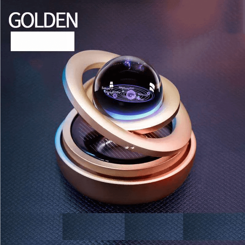 Solar-powered car aromatherapy diffuser with galaxy-themed design, rotating under sunlight for soothing scents.