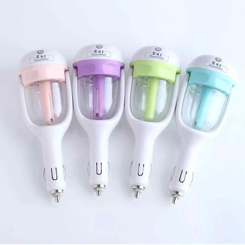 Mini car humidifier with aromatherapy in four colors: pink, purple, green, and blue.