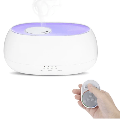 Aromatherapy diffuser humidifier lamp with remote control, producing calming mist in a stylish design.