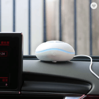 Car Humidifier and Aromatherapy Diffuser on dashboard, enhancing air quality in a vehicle.