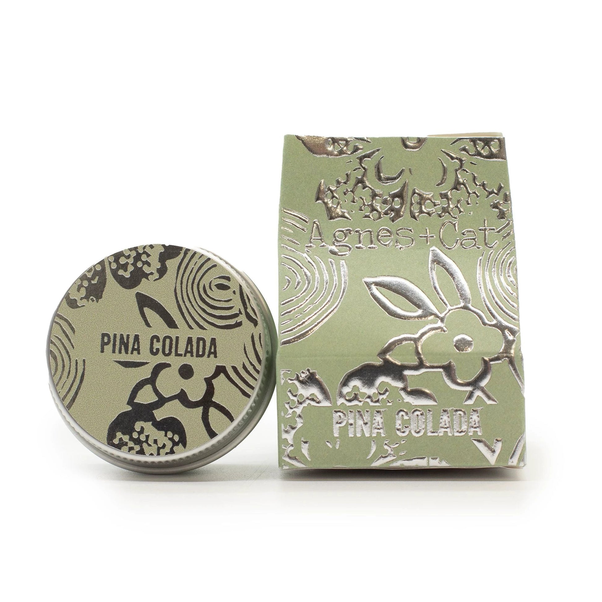 Agnes + Cat Pinacolada lip balm tin with coconut scent packaging, hand-poured in the UK for soft lip comfort.