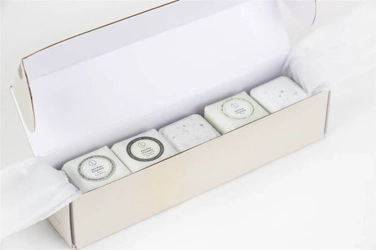 Earthy shower steamers gift set in elegant packaging featuring five different shower steamers for a luxurious experience.