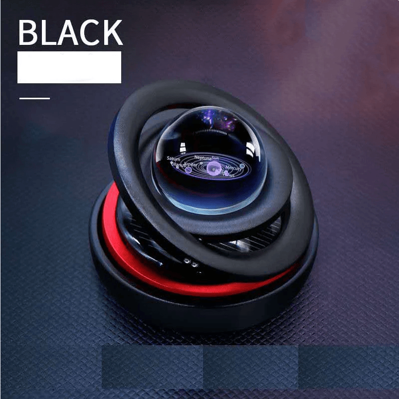 Solar-powered car aromatherapy diffuser with galaxy design and rotating feature.