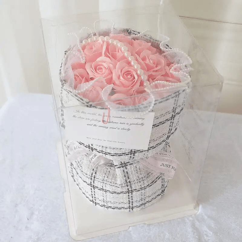 Elegant Soap Flower Bouquet encased in clear box with pink roses and decorative pearls.