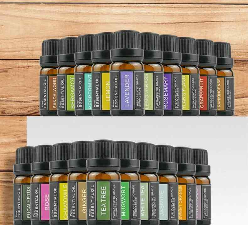 Aromatherapy essential oil blends for relaxation, showcasing a collection of 20 essential oil bottles on a wooden background.