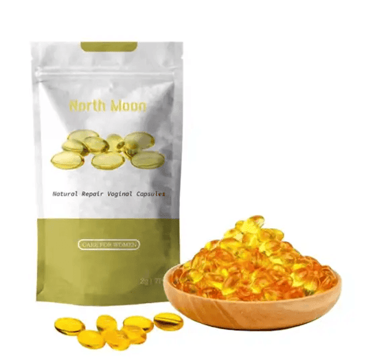 North Moon Natural Repair Vaginal Capsules in a bag and a wooden bowl filled with yellow capsules.