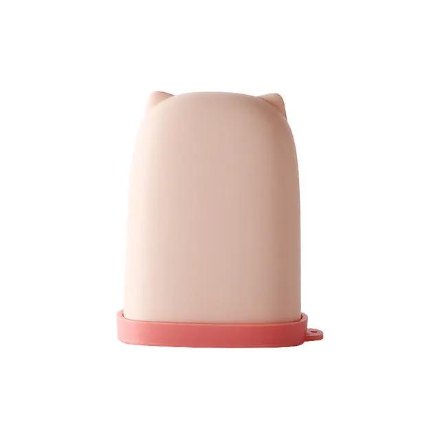 Cute waterproof silicone soap dish designed for travel, featuring a playful cat ear design in pink.