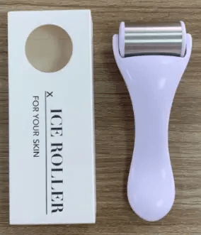 Facial beauty massage tool next to its packaging, promoting skin rejuvenation and relaxation.
